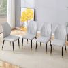 4 light gray modern dining chairs with stylish PU patterned backrest and black metal legs for a comfortable home experience in the kitchen